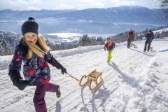 Rodeln_Familie_Millstatter-See_Winter-©Gert-Perauer_MBN-Tourismus-3